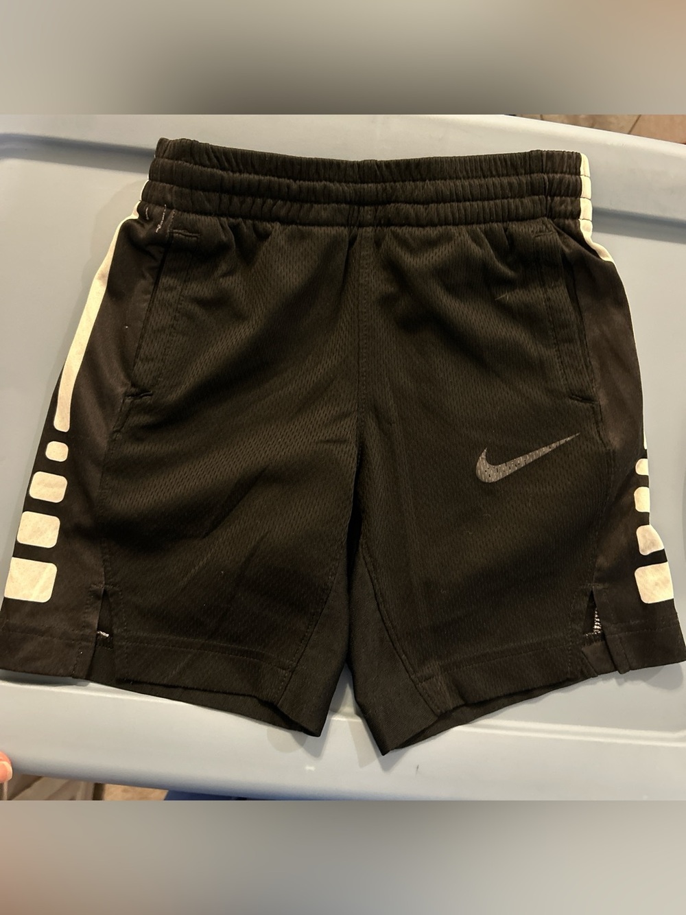 Nike Black Athletic Shorts with White Side Stripe and Reflective Swoosh